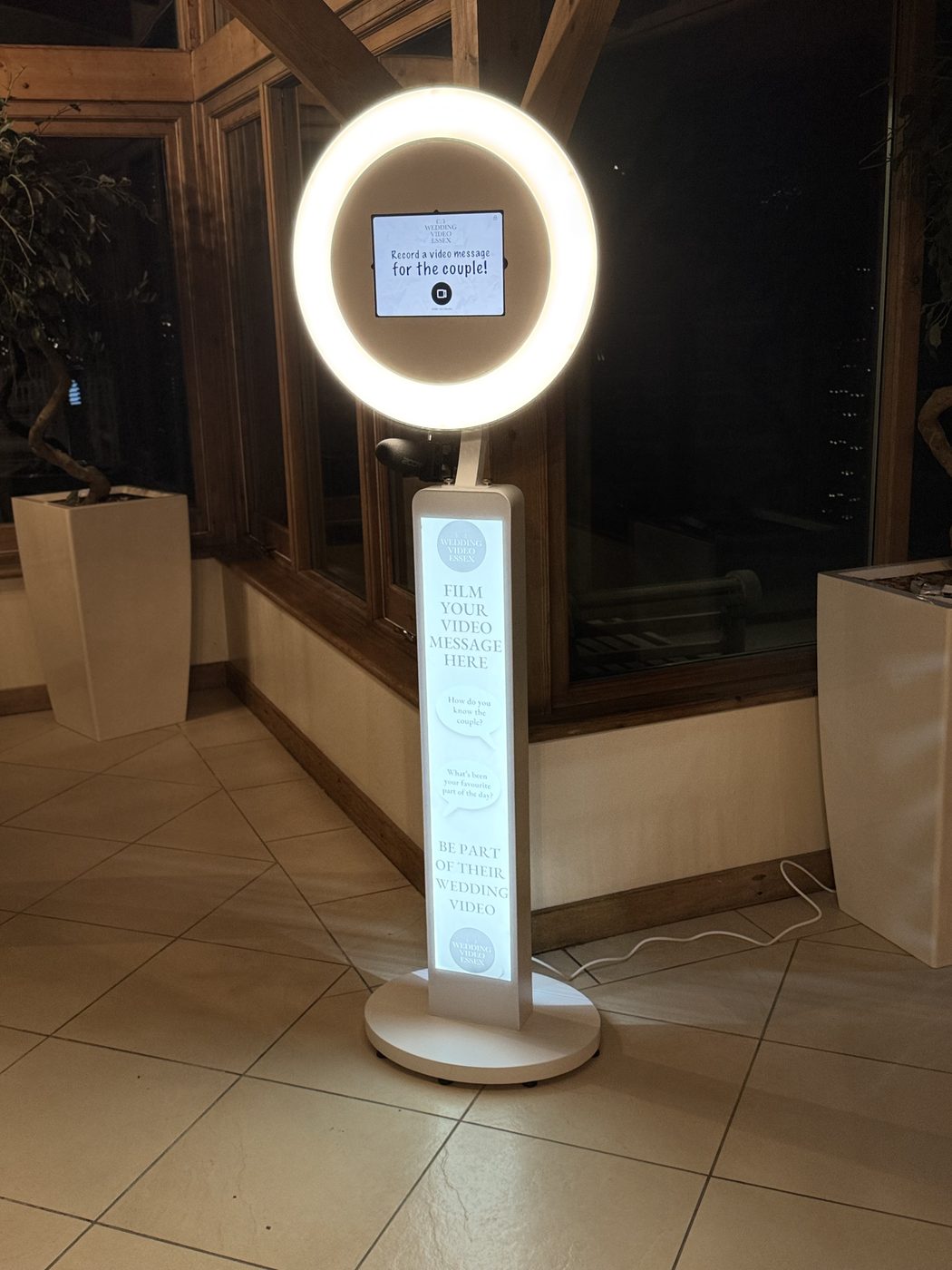 Slimline video guestbook booth at a wedding venue
