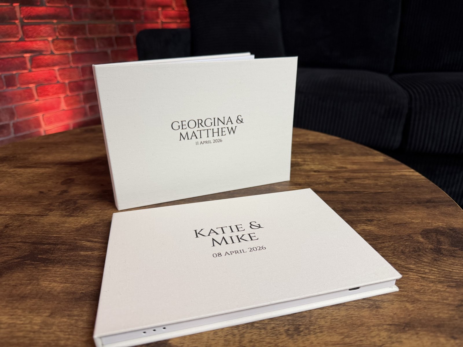 Personalised Wedding Video Albums with couples' names on linen covers